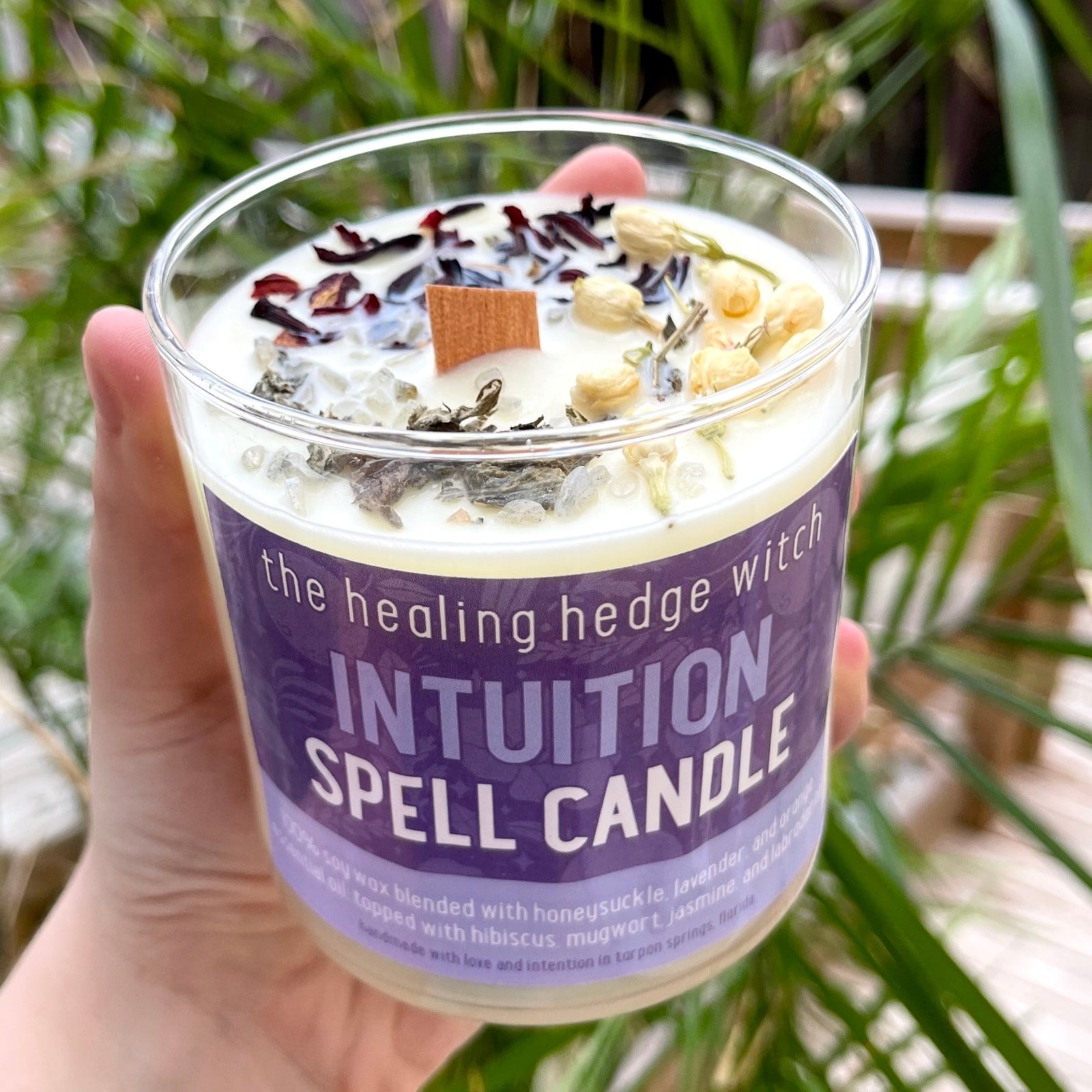 Intuition Spell Candle Bring your intuition into focus with this hand-poured, small-batch 8-ounce spell candle. Scented with lavender, orange, and honeysuckle essential oils & topped with hibiscus, mugwort, jasmine, and labradorite.