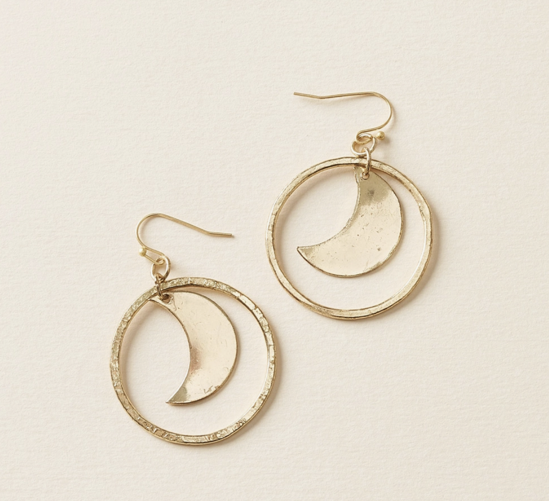 Crescent Moon Gold Hoop Dangle Earrings: handcrafted drop earrings feature a smooth, crescent moon charm encircled by a hand hammered loop charm and ball-tipped fish hooks in gold finish