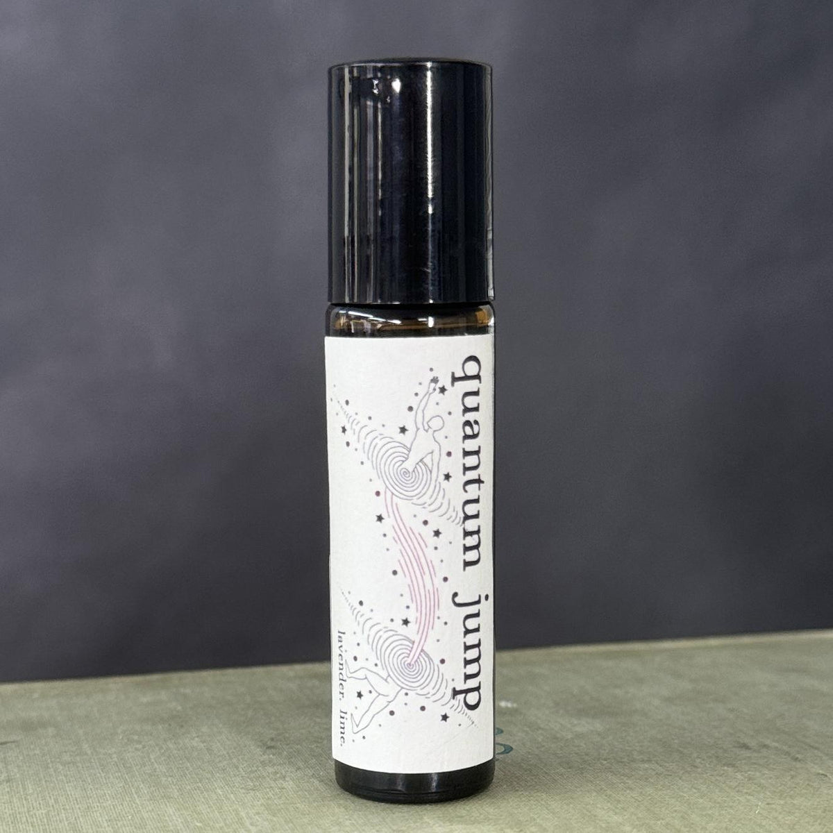 hand crafted Quantum Jump Oil, Quantum Jump on the go 10ml Roll On 1oz Dropper Bottle use in baths, spell jars, or as a dressing for candles! Lavender and lime essential oils grapeseed oil base.Dropper Bottle is infused with clear quartz.
