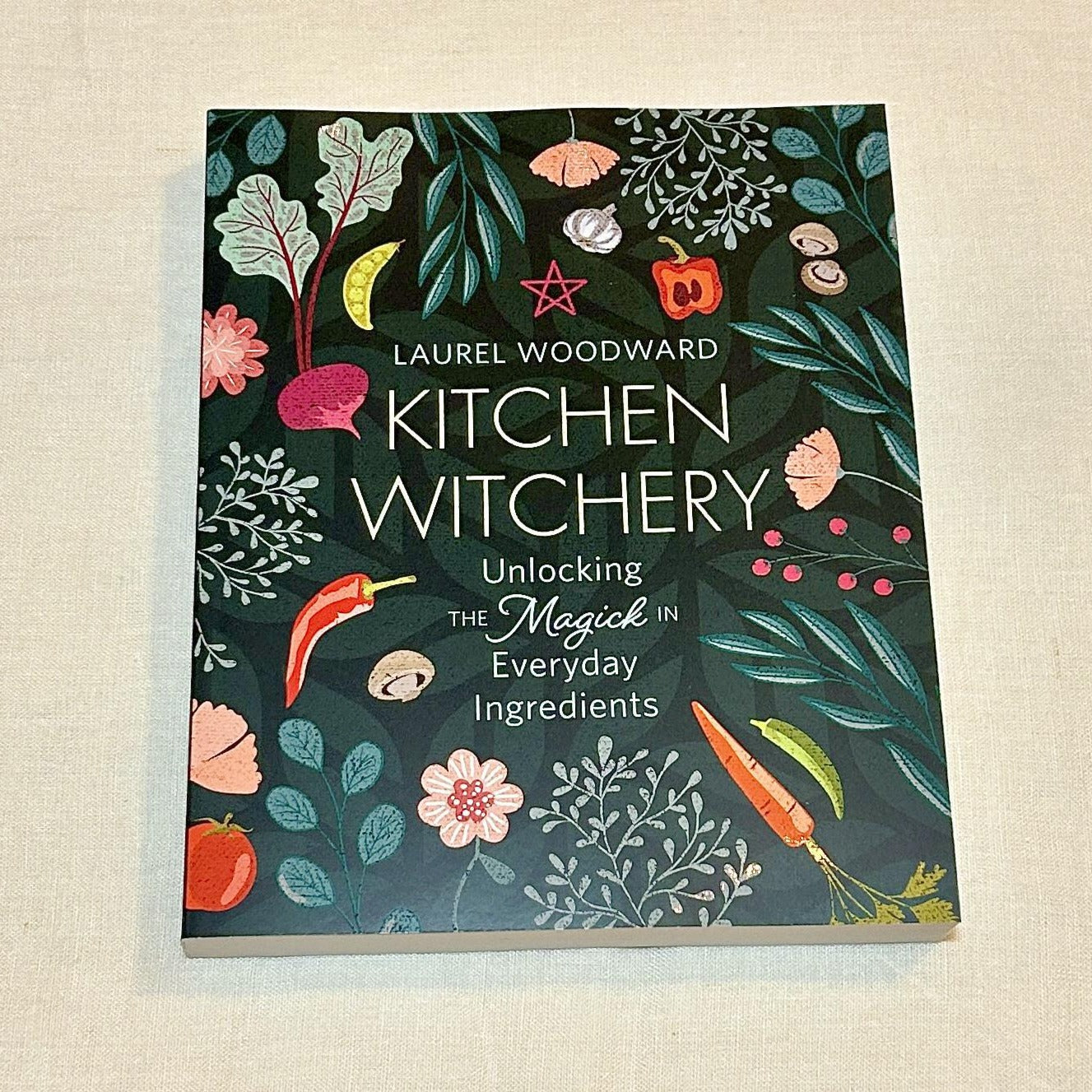 Kitchen Witchery: Unlocking the Magic in Everyday Ingredients. Featuring a wide variety of recipes, correspondences, and techniques, this practical guide elevates the way you cook and prepare meals. Laurel Woodward shares the magick of everyday things, revealing how each task can become a ritual of creation. Organized by food type, this book teaches the magickal ins and outs of: