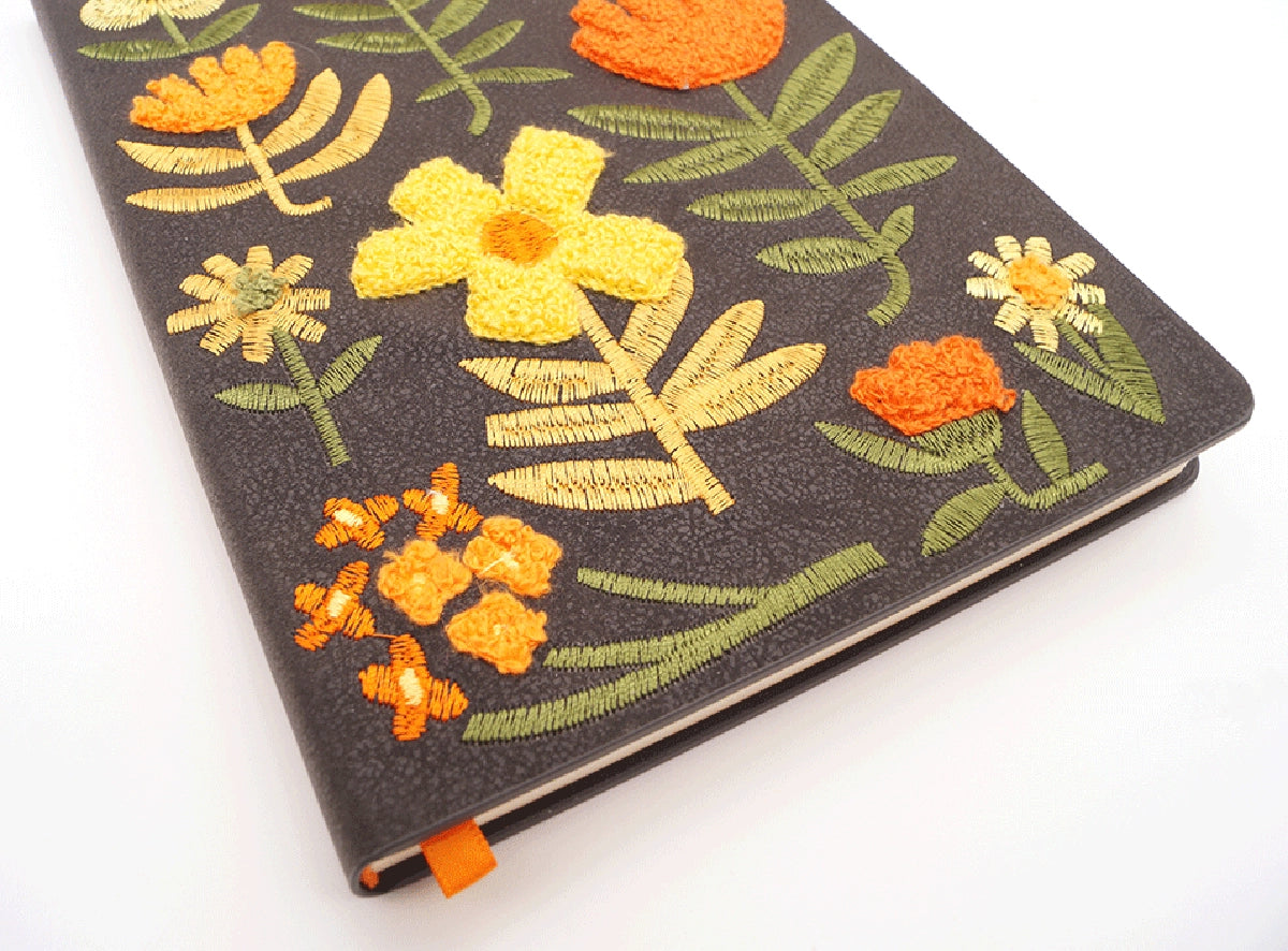 Chunky Flowers Embroidered Journal Notebook yellow and orange flowers with green and yellow stems on charcoal colored faux leather