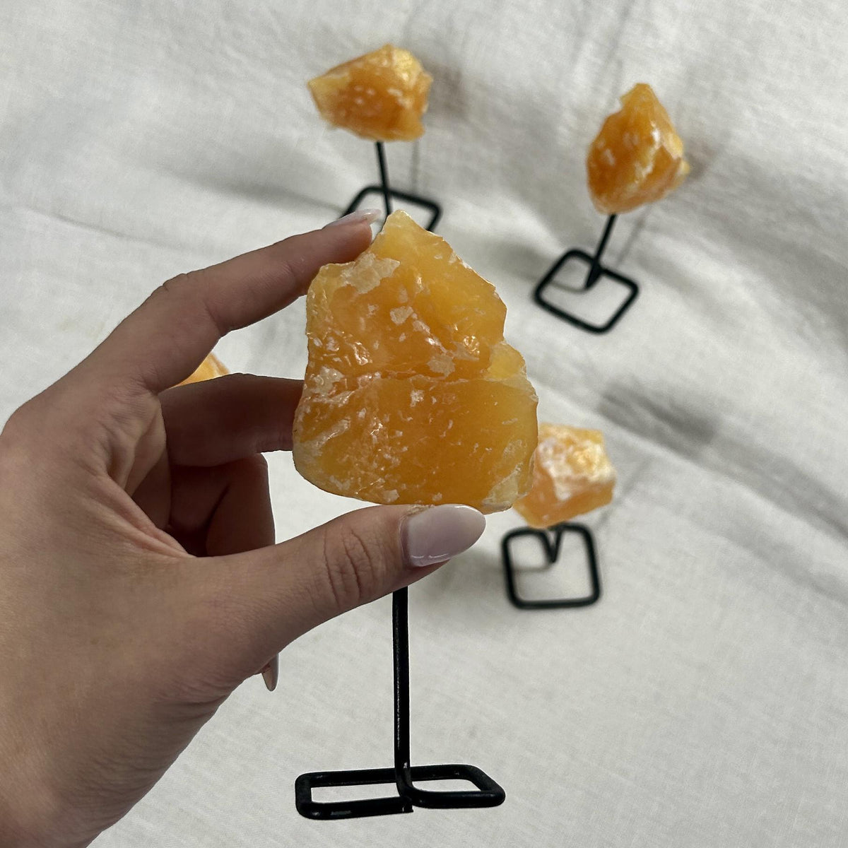 Orange Calcite Rough Crystal on Display Stand