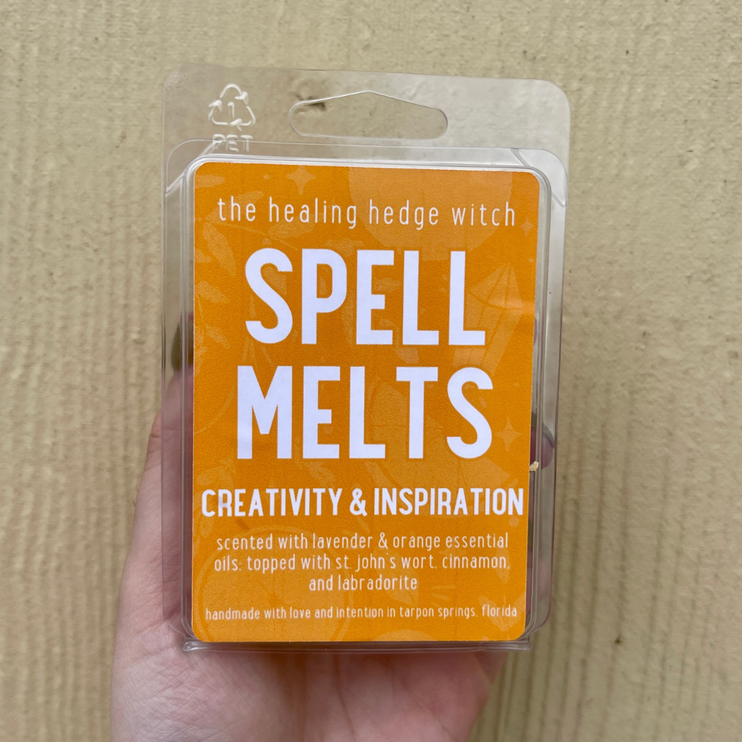 creativity and inspiration spell wax melt scented with lavender & orange essential oils & topped with St. John's wort, cinnamon, and labradorite