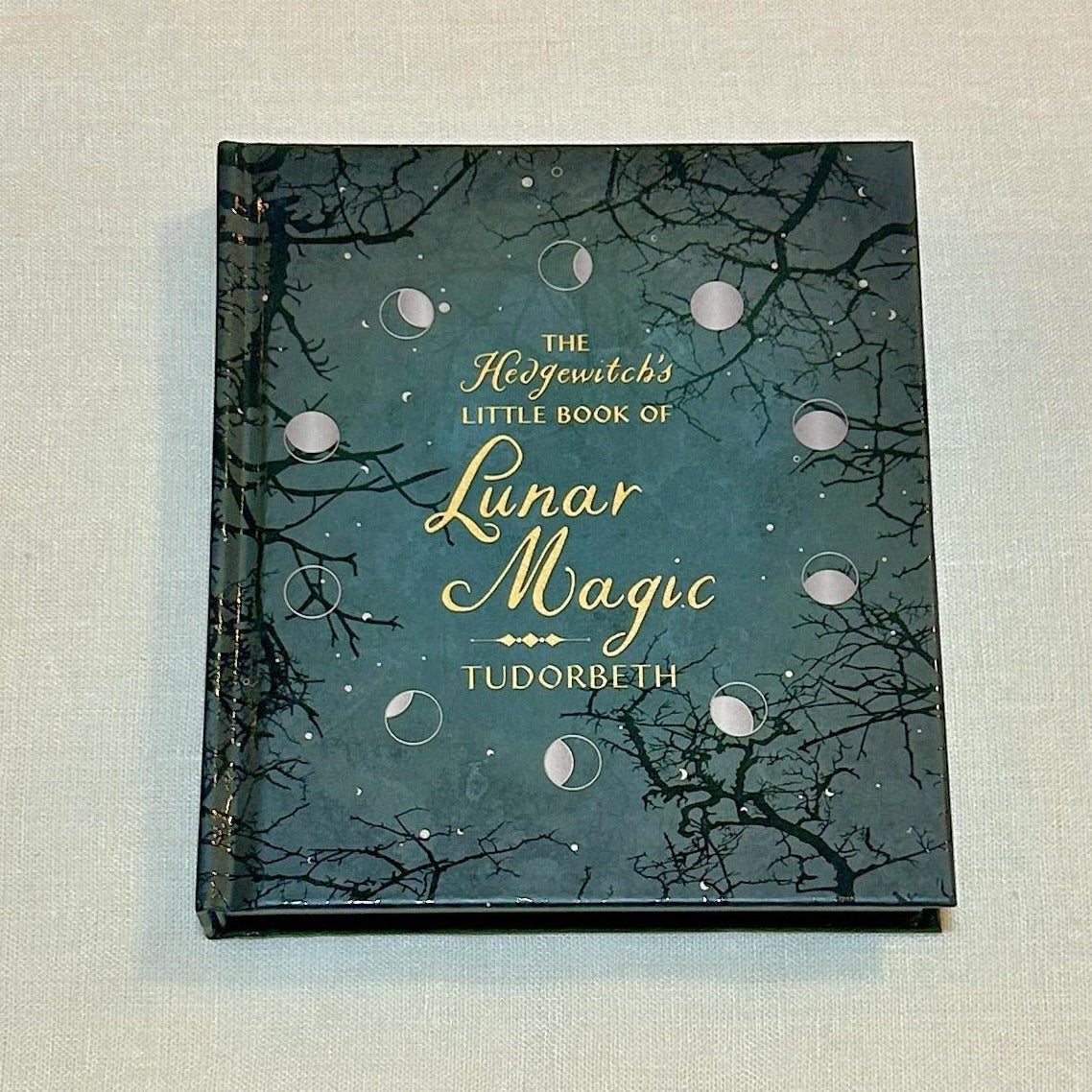 The Hedgewitch's Little Book of Lunar Magic. Discover lunar myths and legends as well as correspondences to herbs, crystals, and deities. You will also learn how to connect with changing energies in each season and moon phase. With guidance for drawing down the moon, making moon water, creating a moon altar, and other sacred activities, The Hedgewitch's Little Book of Lunar Magic features ample inspiration for honoring and harmonizing with this revered celestial body.