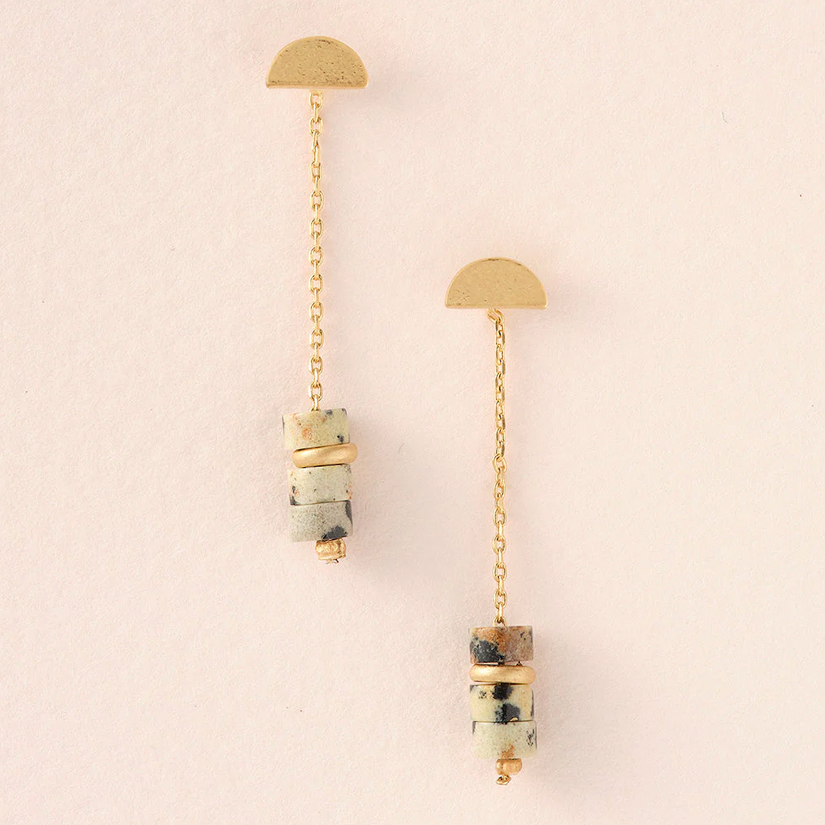 Dalmatian Jasper Gold Meteor Earring Minimalistic charm to adorn your ears. Lightweight with the perfect amount of color and shape.  1.5&#39;&#39; drop 14K gold dipped brass Nickel and cadmium free Hypoallergenic Earrings come on embossed leather card with gold foil &amp; stone meaning on back.