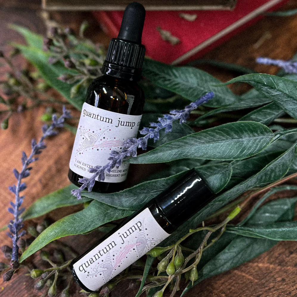 Get ready for a total timeline shift with our hand crafted Quantum Jump Oil. Bring Quantum Jump on the go with a 10ml Roll On, or use the 1oz Dropper Bottle in baths, spell jars, or as a dressing for candles! Lavender and lime essential oils with a grapeseed oil base. 1oz Dropper Bottle is infused with clear quartz.