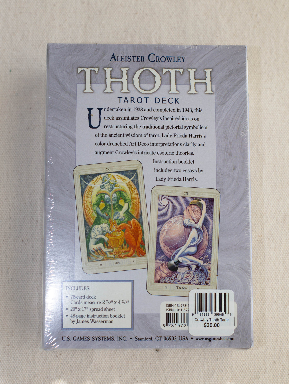 The back of a sealed Crowley Thoth Tarot Deck — Premier Edition box by The Healing Hedge Witch displays two card artworks, product details, a barcode, included contents, and background information.