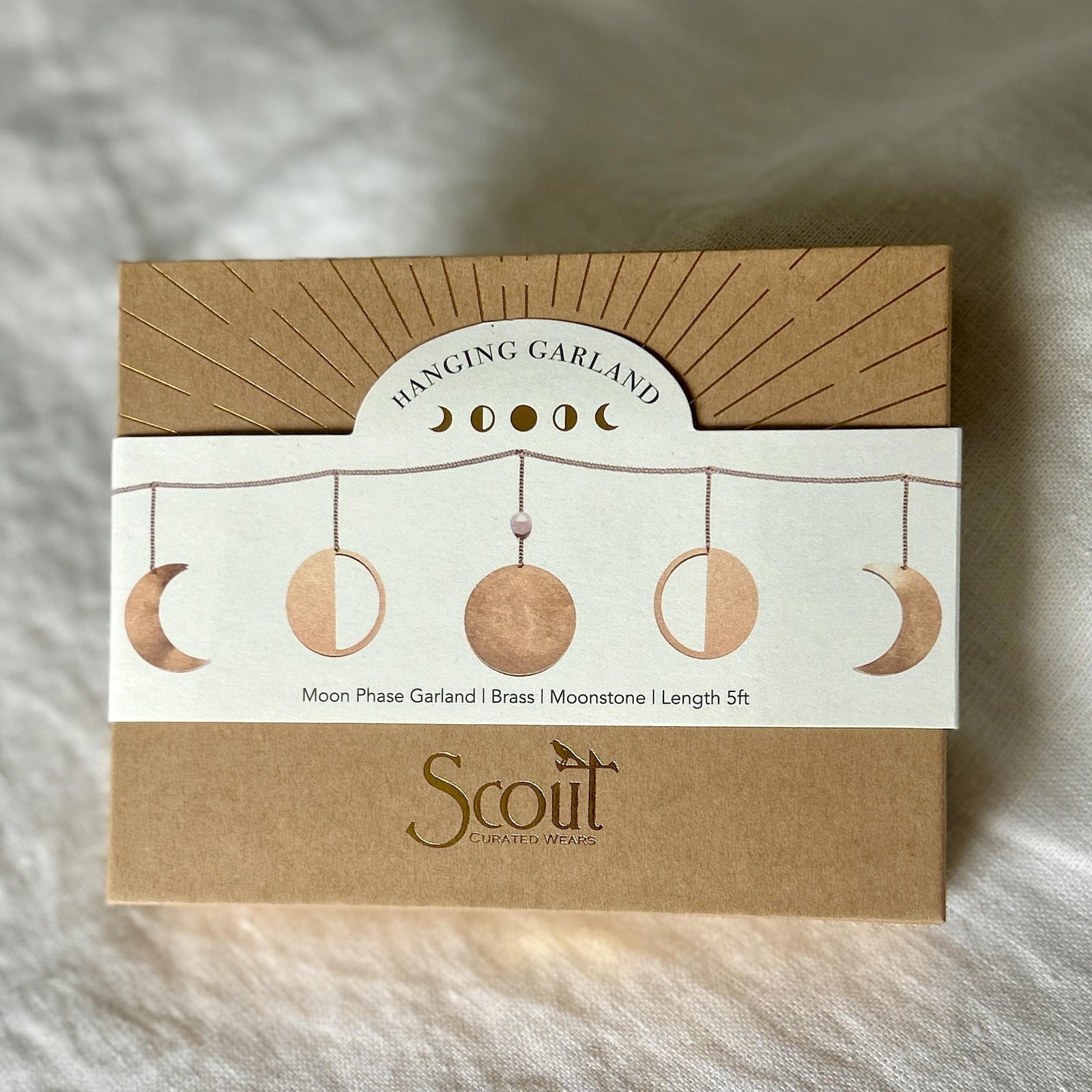 Moon Phase Moonstone GarlandNatural brass, semi precious stone detail, hooks for hanging.
Comes packed in a beautiful box &amp; muslin bag for gift giving.