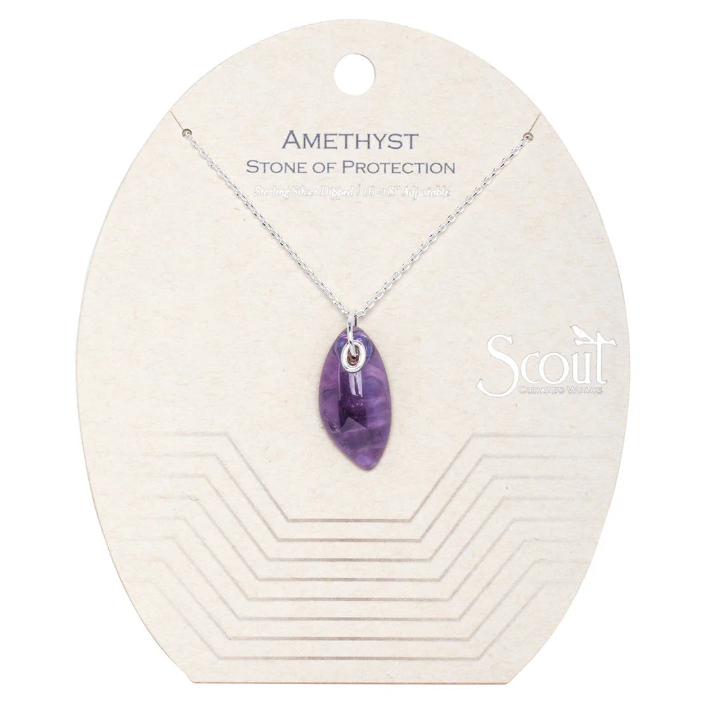 The Healing Hedge Witch's Organic Stone Necklace features a marquise-cut amethyst pendant on a sterling silver chain, presented on a minimalist card labeled “Amethyst Stone of Protection” with subtle geometric accents.