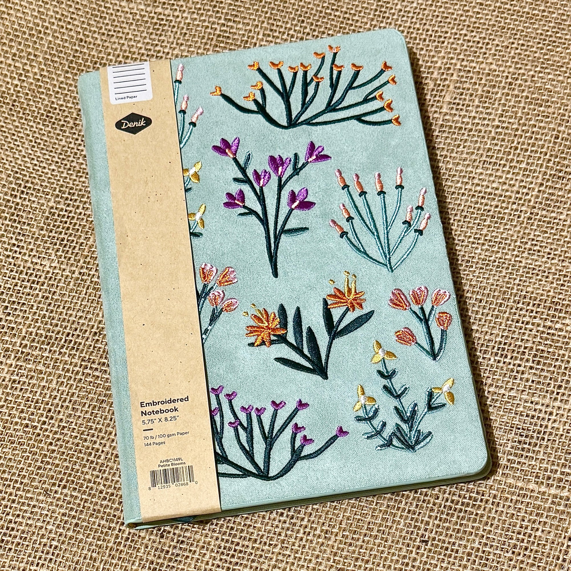 Petite Blooms Layflat Journal with purple orange yellow and pink flowers on blue green background color