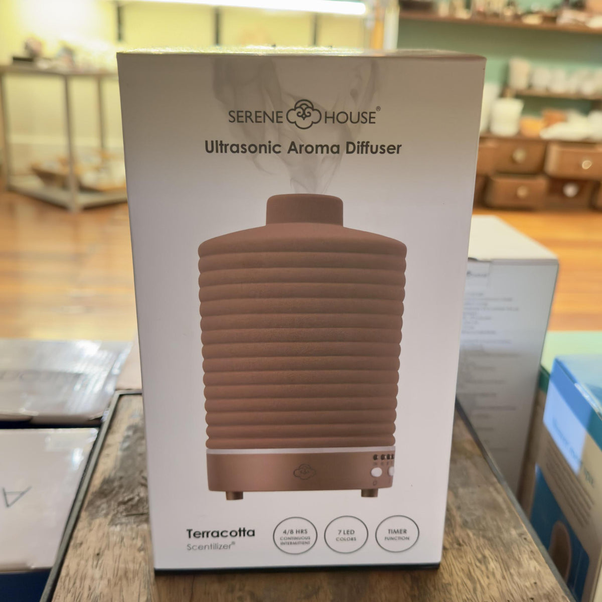 Terracotta Ultrasonic Aroma Diffuser features a 4-8 hour run time, 7 LED colors, a timer function, a 3 oz. water capacity, ac adaptor for operation, instruction manual, and warranty card. Use with water and essential oil, not included. Indoor use only. Diffuser measures approxiamtely 5.7 in. H x 3.5 in. W.