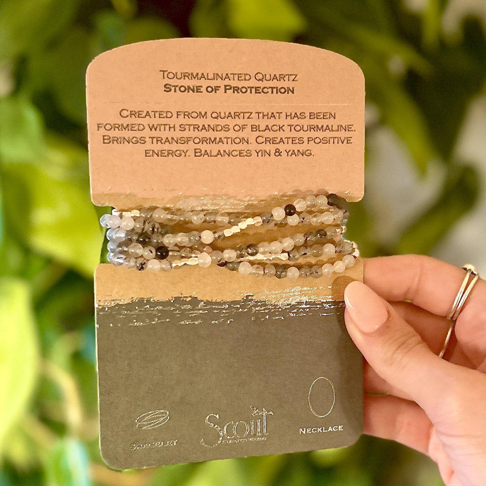 Tourmalinated Quartz Stone Wrap Bracelet. Tap into the energies of the earth.  Semi precious gemstones adorn wrist & neckline. Effortlessly converts from bracelet to necklace.  Can be wrapped 4-5 times as a bracelet and 1-2 times as a necklace. 