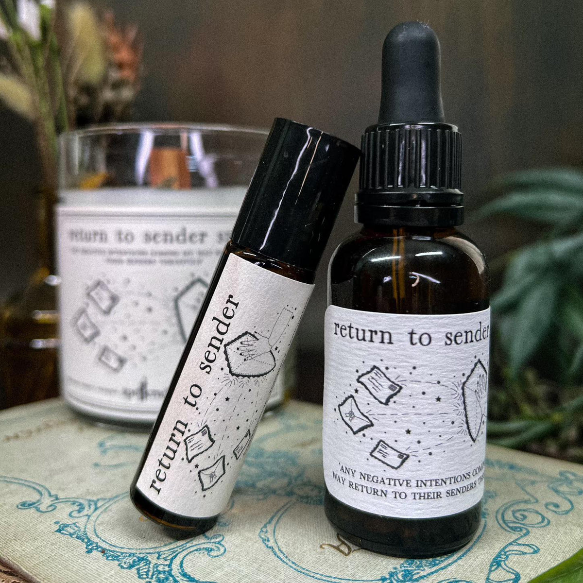 hand crafted Return to Sender Oil. Bring Self Love on the go 10ml Roll On, or use the 1oz Dropper Bottle in baths, spell jars, or as a dressing for candles! Rosemary, lemongrass, and frankincense essential oilsgrapeseed oil base.Dropper Bottle is infused with tiger eye.
