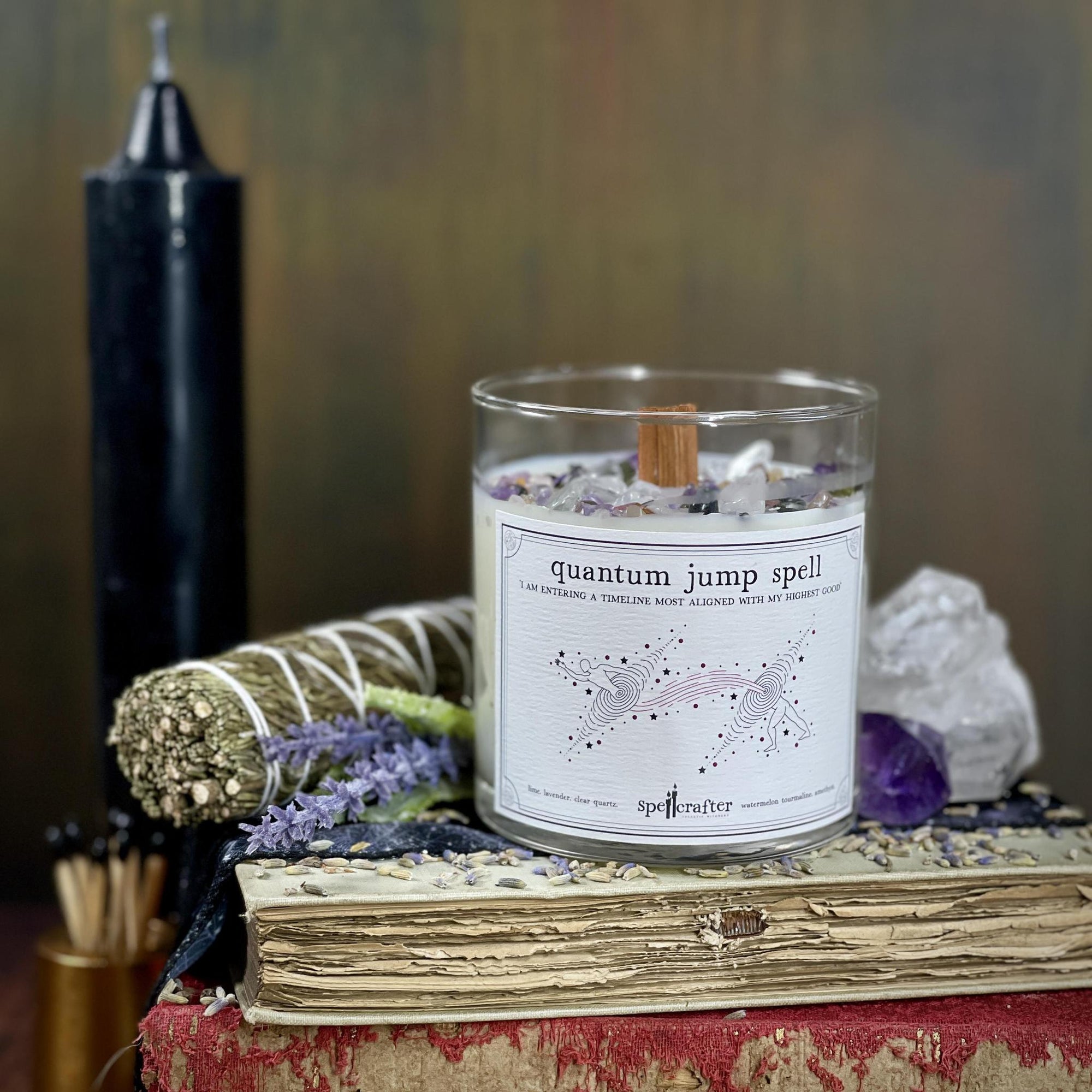 quantum jump spell candle hand poured, small-batch 8-ounce spell candle! Scented with lime and lavender essential oils &amp; topped with clear quartz, watermelon tourmaline, and amethyst.