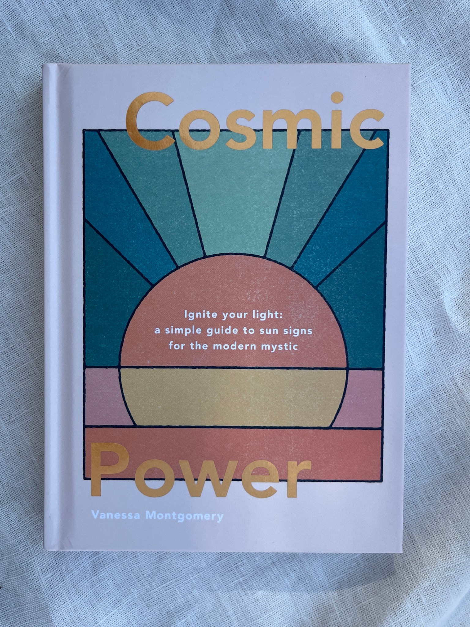 Cosmic Power book ignite your light: a simple guide to sun signs for the modern mystic by vanessa montgomery