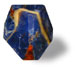 The SoapRocklet by T. S. Pink Corp is a glossy, multi-sided polyhedral die in blue, red, and yellow marbled colors, echoing the natural look of SoapRock soap and casting a faint shadow on a white background.