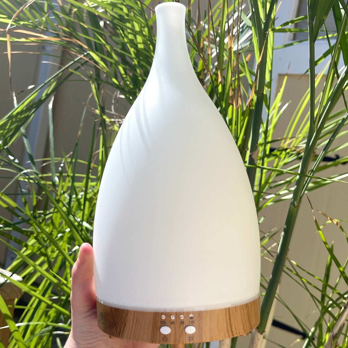 Large White Ceramic Diffuser Teardrop wood bottom Aromatherapy 7hr continuous / 14hr intermittent run time in addition to the 60, 90- and 120-minute timer modes.