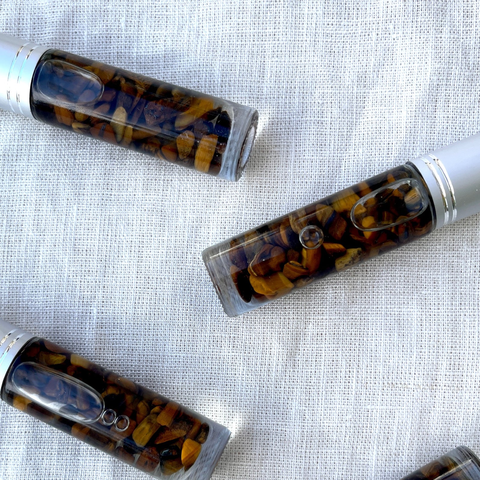 Protection Crystal Charged Essential Oil Roller A blend of palo santo and frankincense essential oils with tigers eye chips